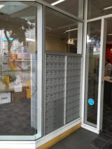 Aluminium window with postbox installation